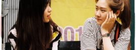 two girls sitting and talking